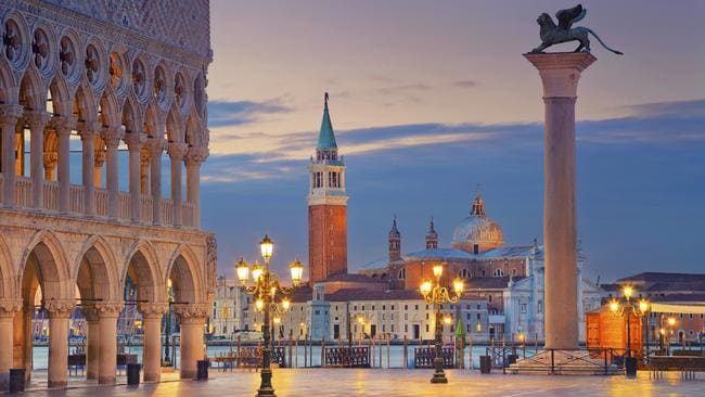 You have to hit St Mark’s Square at dawn, if you want a photo like this. Or perform a magic trick.