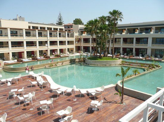 Second pool, with swim up rooms pool around outside (68854406)